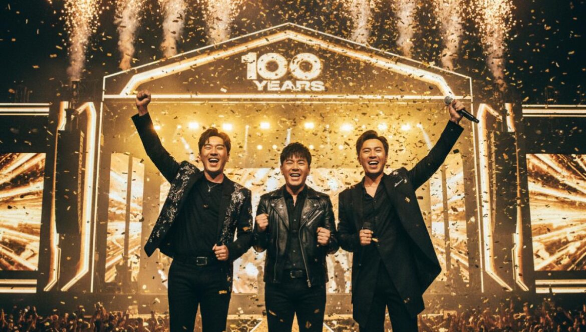 BIGBANG 2026: ¿álbum, gira y Coachella? Las pistas reales y el papel de T.O.P que no viste venir Trío de idols sobre un gran escenario nocturno, luces doradas, confeti y estilismos negros, listos para un regreso épico.